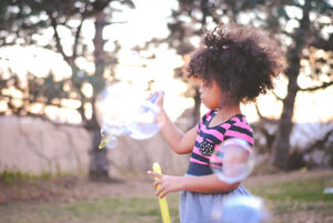 portrait of my niece blowing bubbles in omaha, nebraska